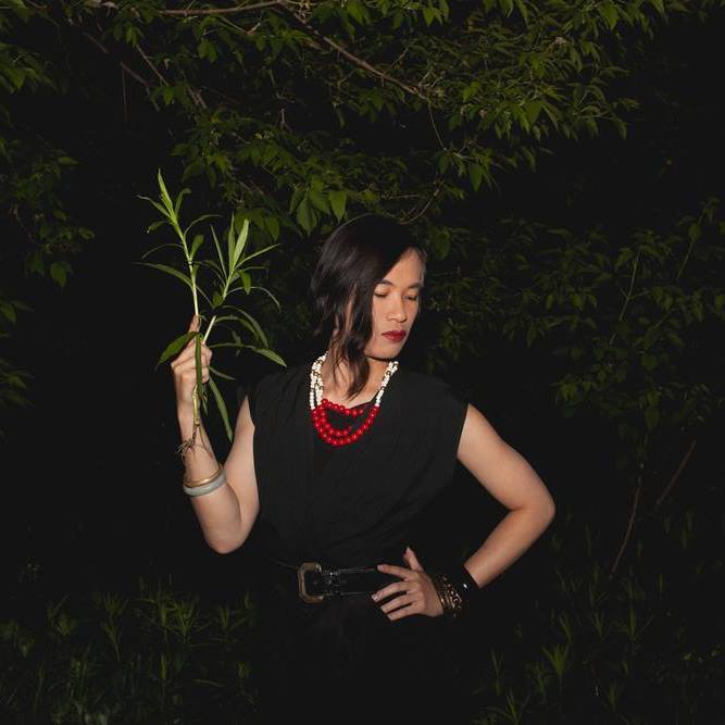 Photograph of Kai Cheng Thom doing her performance during the residency