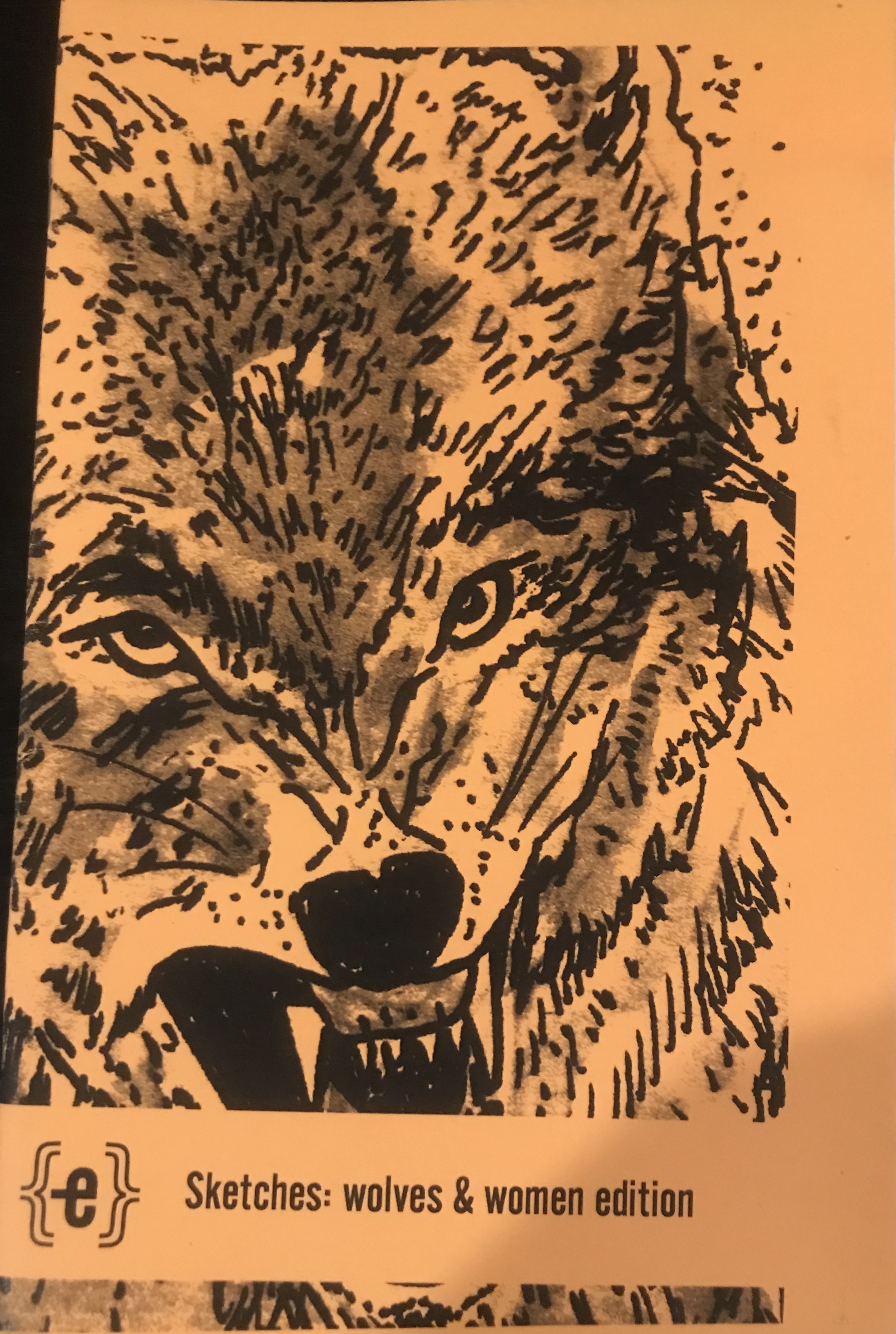 Orange cover with a drawing of a wolf. 
