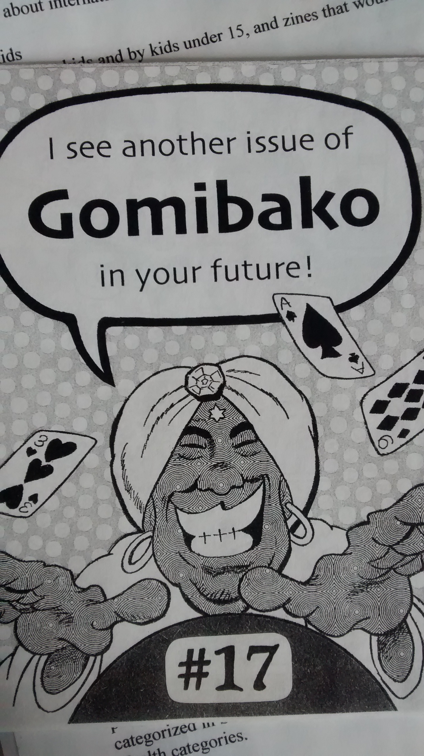 Cartoon of a turban-wearing Genie mid-card trick, with flying cards (3 of Hearts, Ace of Spades, 9 of Diamonds) with a speech bubble reading, "I see another issue of Gomibako in your future!". Centred at bottom is the issue number, 17