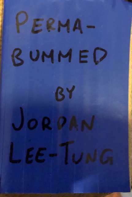 blue cover, black marker writing reads "PERMA-BUMMED BY JORDAN LEE-TUNG"