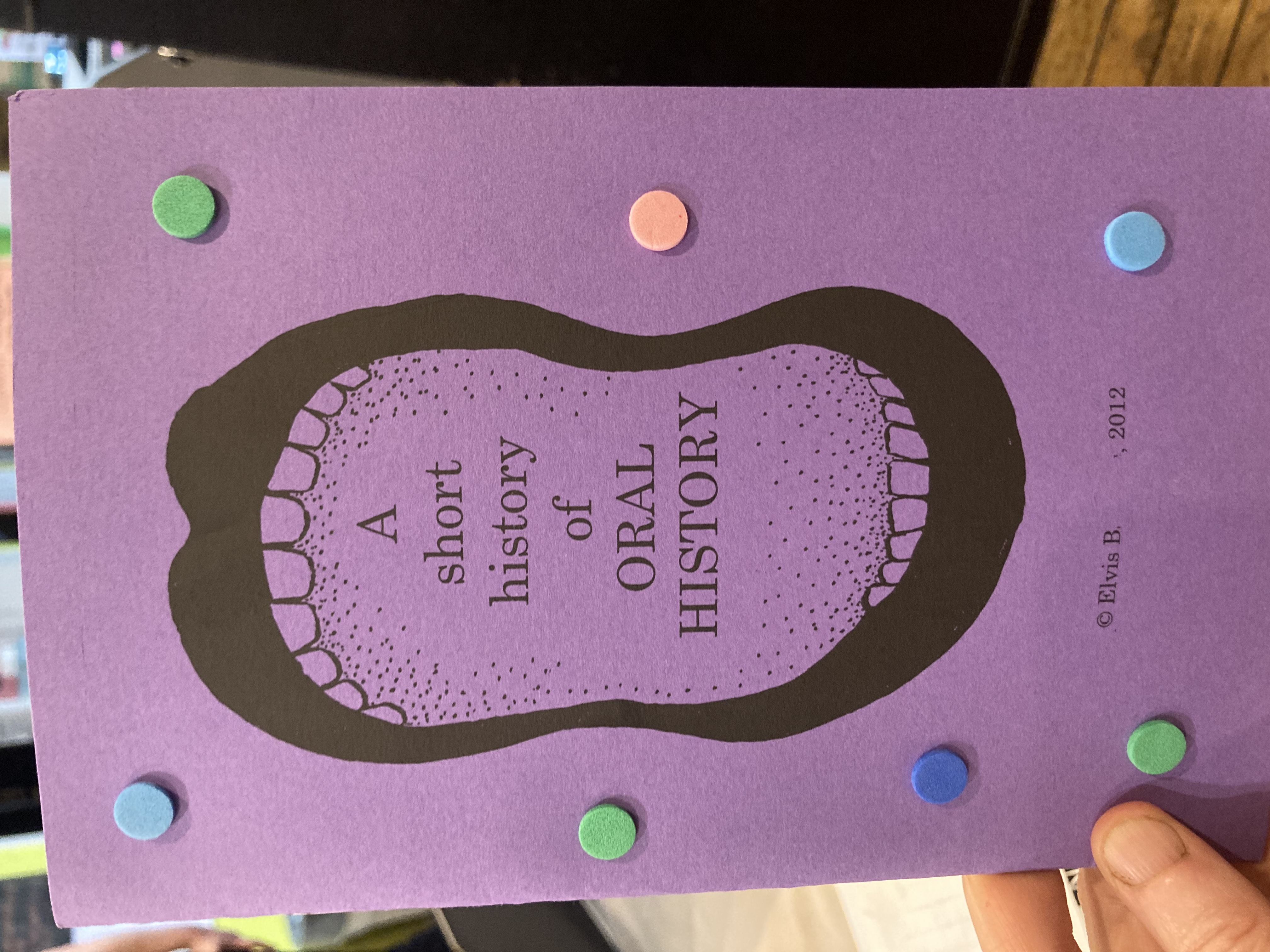 An open mouth on a purple cover with "A Short History of Oral History" in it