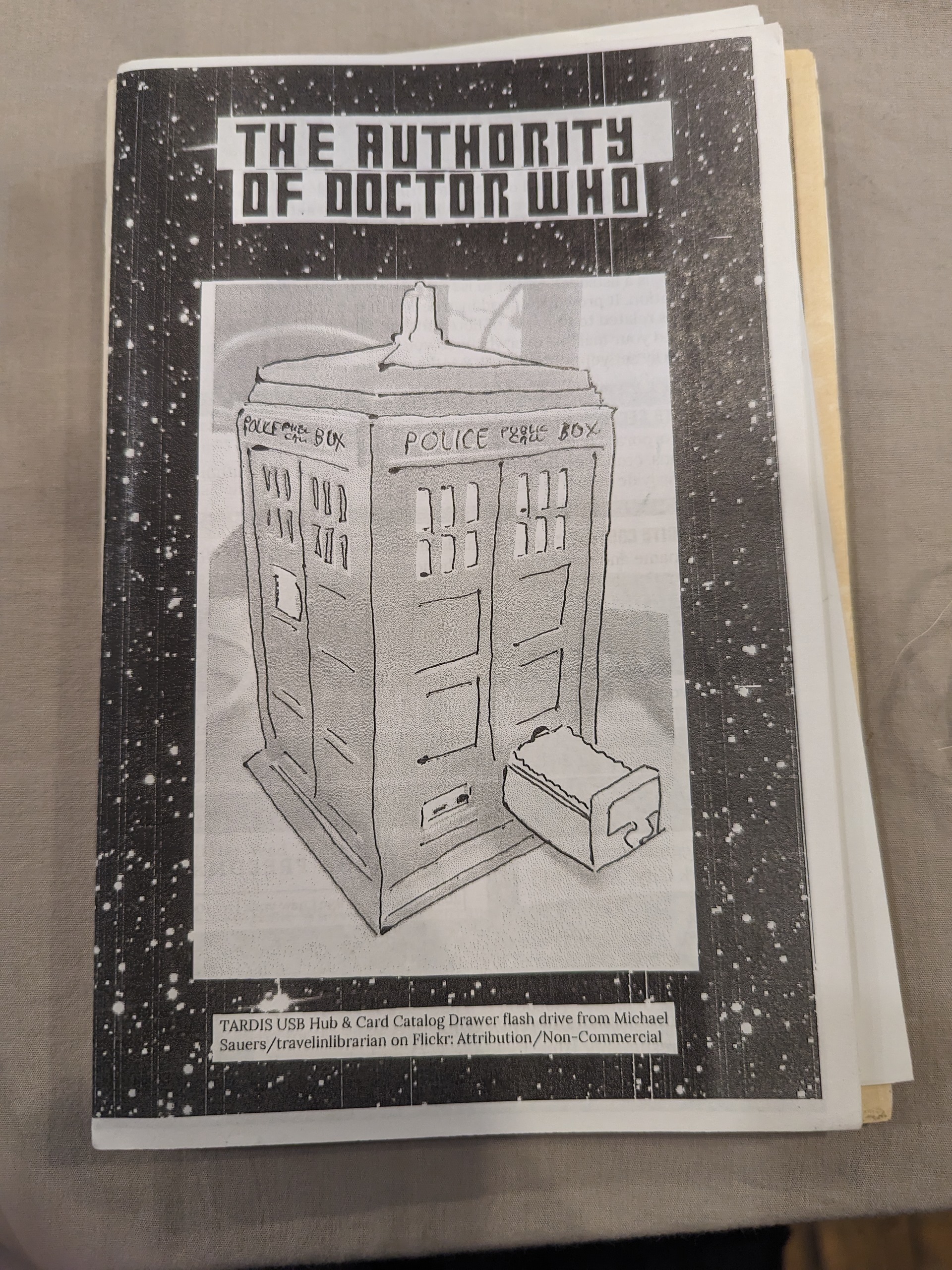 If you are familiar with doctor who, it's the tardis on the front. If you aren't familiar, it's a UK police box