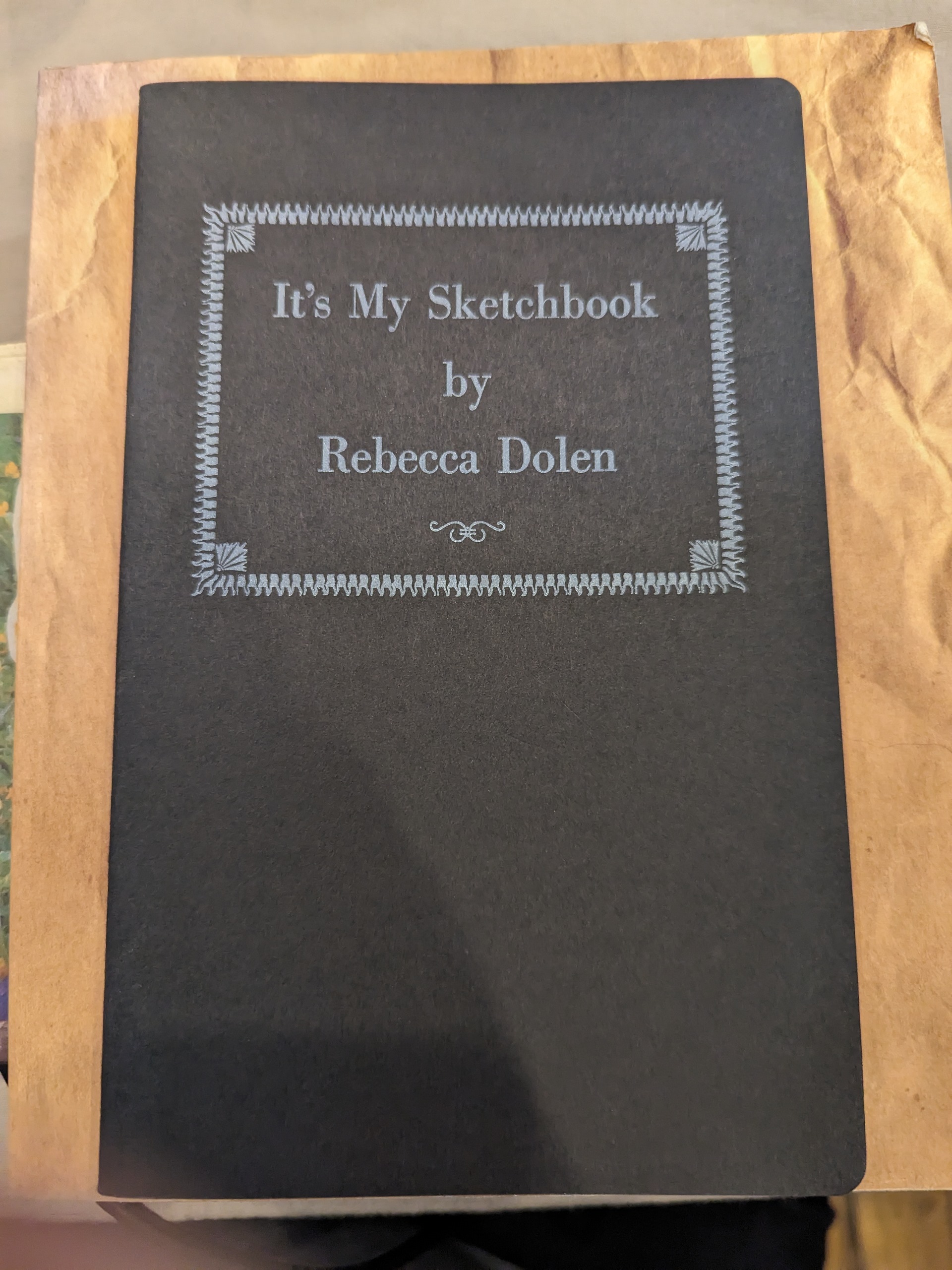 Charcoal Black cover with a gray bordered title