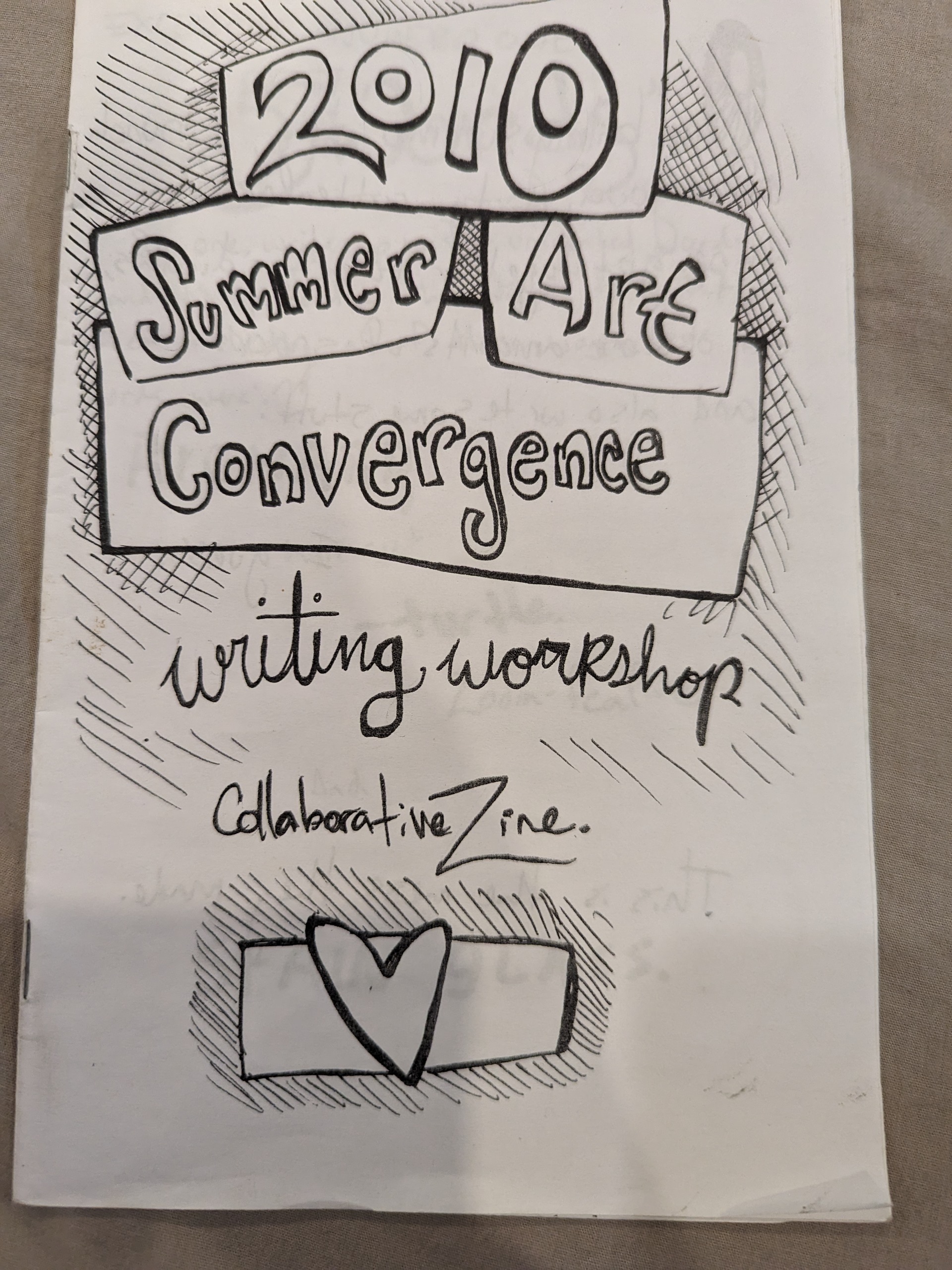 There's a small envelope with a heart at the bottom of the cover. Otherwise all that's there is the title