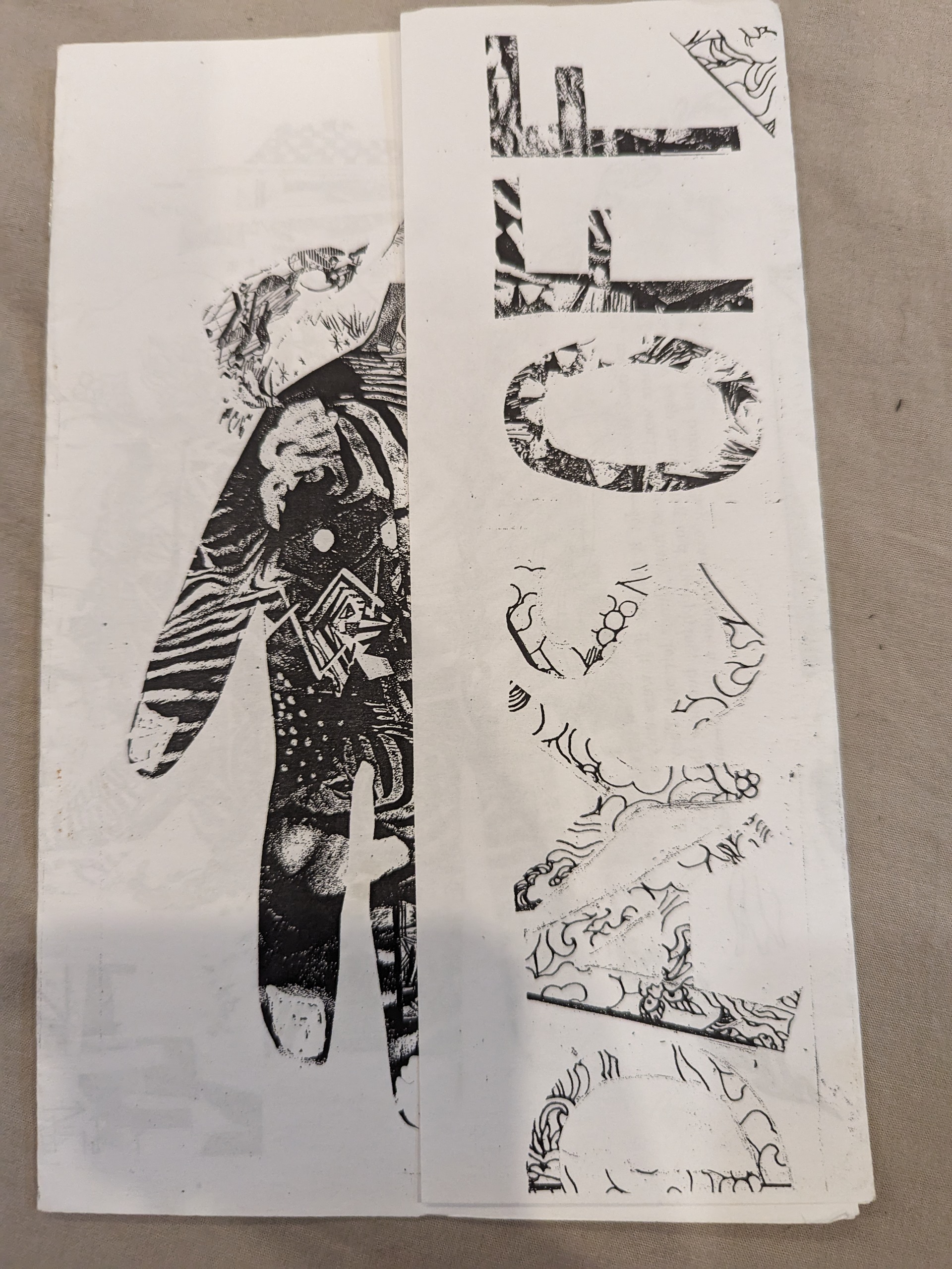 Black and white picture of a hand made out of collage images